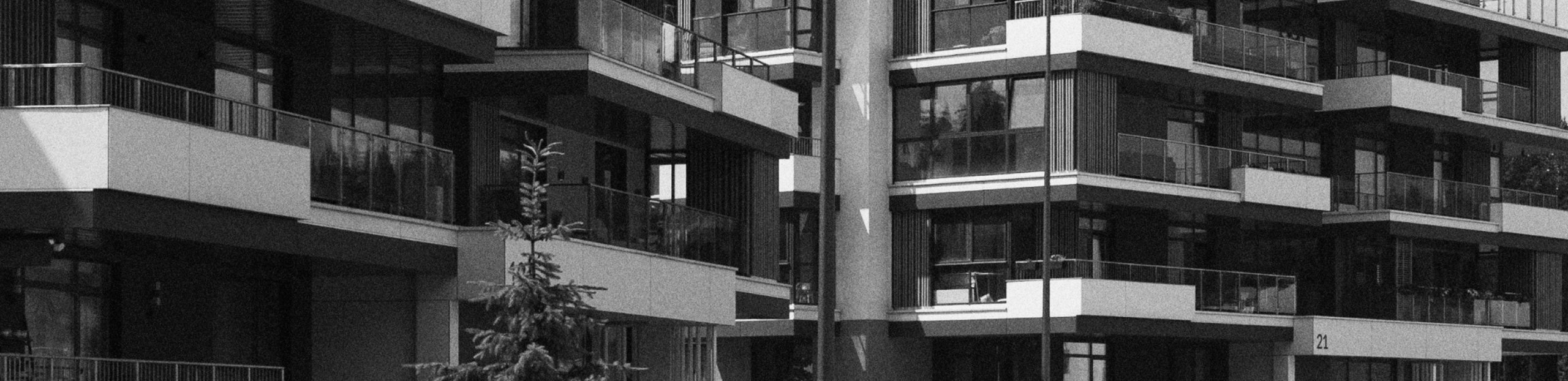 Modern apartment building reflecting real estate law services for Poles in the UK