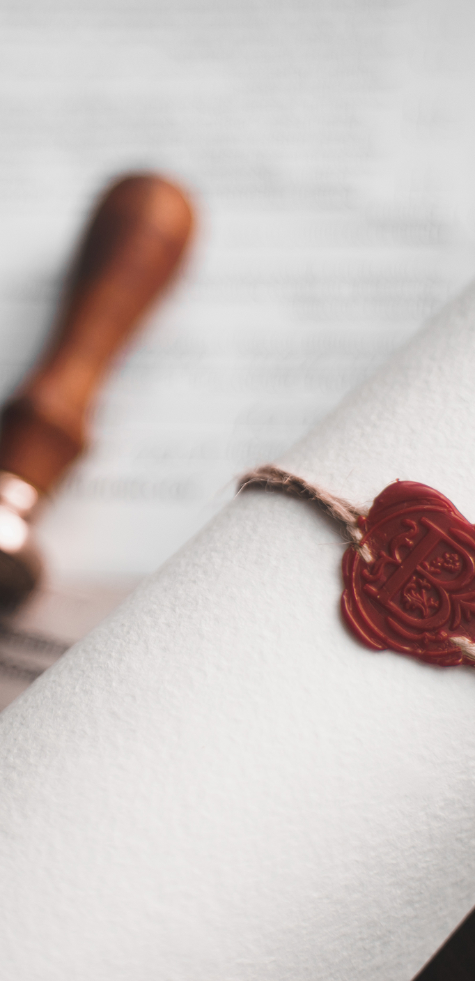 Probate and succession documents under UK law Rolled legal document with wax seal symbolising inheritance proceedings in the UK